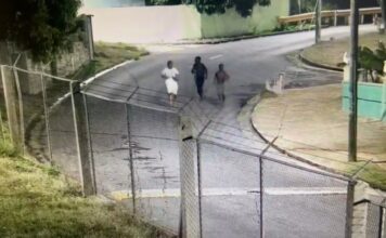 Image: Screenshot image shows three juvenile males running as captured in surveillance footage, after allegedly being involved in malicious damage relating to multiple incidences of malicious damage to passing vehicles on the F. T. Williams Highway between July 10, 2023 and July 21, 2023 (Credit: Facebook/The Royal St.Christopher and Nevis Police Force)