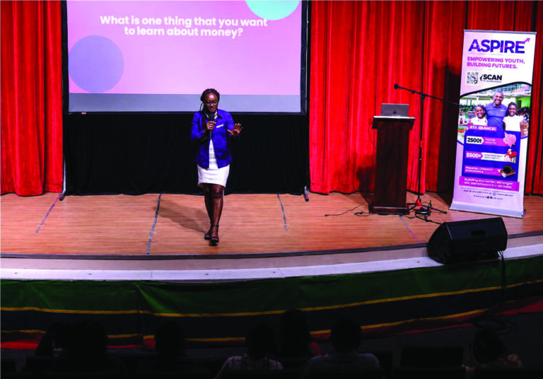 Sybil Welsh, Senior Project Specialist at the Eastern Caribbean Central Bank leads a money management session with fifth