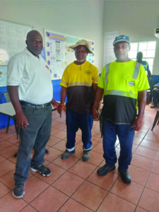 Union Field Officer and Executive Committee member Sean Kelly (right end) and Shop Steward Alfred ‘Joash’ Liburd (third