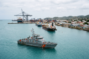Patrol vessel and cargo ships in St. John's harbour, Antigua