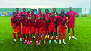 The St. Kitts and Nevis U15 Boys Team pose for a team photo ahead of one of their historic FIFA U15 World Cup match.