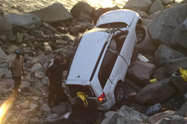 BREAKING NEWS: Vehicle Crashes Into Rocks At Old Road Bay