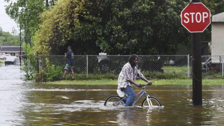 Weakened Barry unleashes a final blast of torrential rains