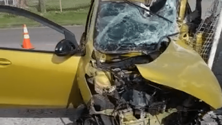 Driver Escapes With Scratch After Car-Entrance Crash